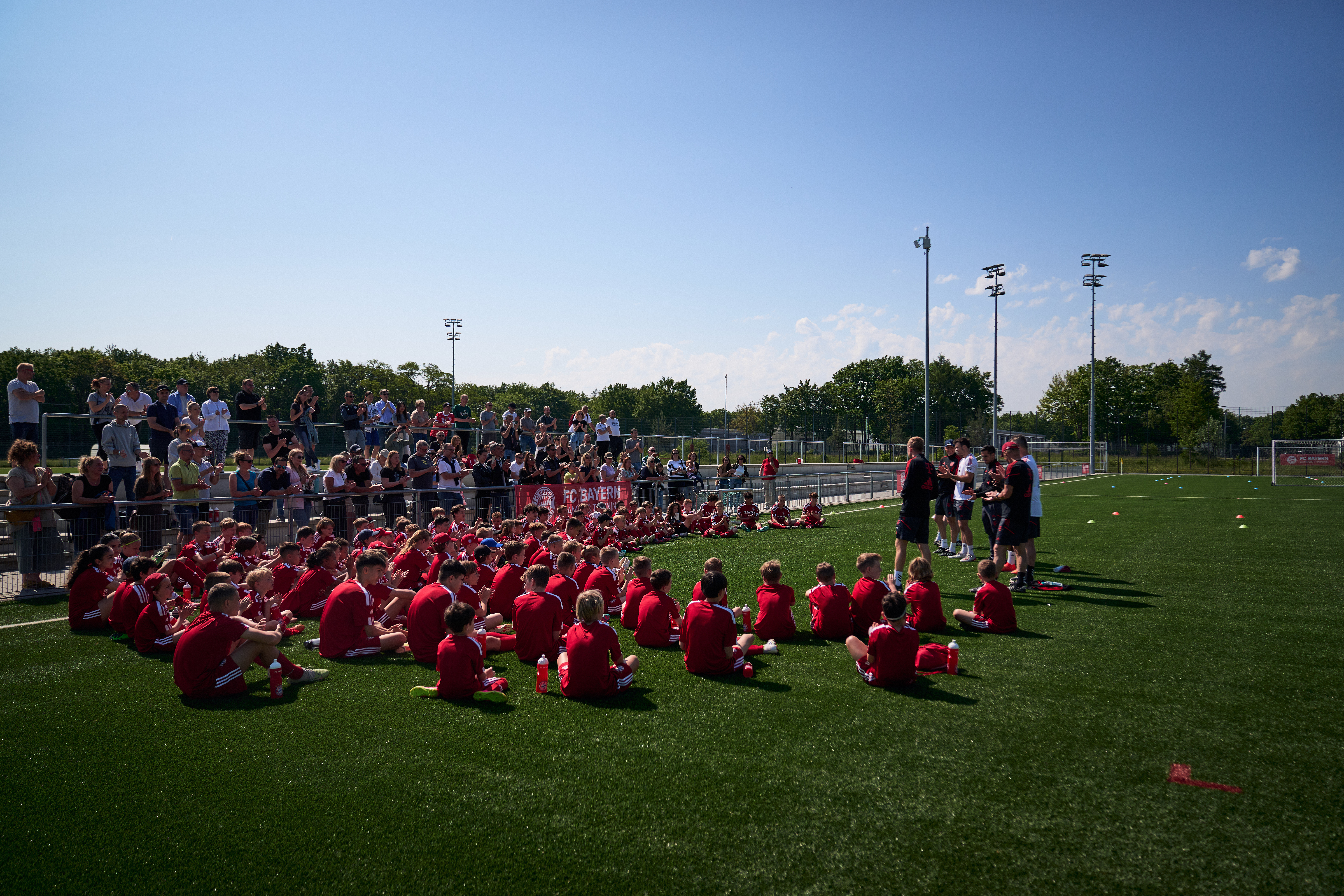 Young players taking part in soccer team-building activities on the field