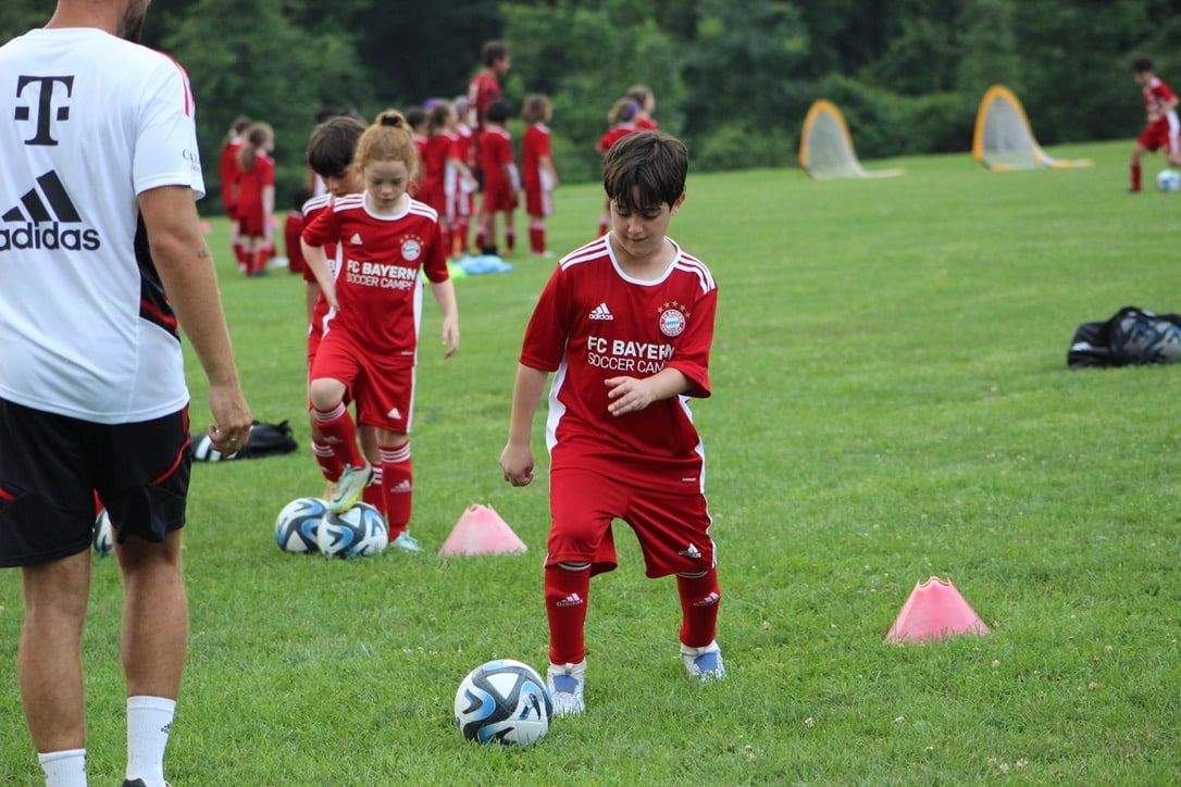 Best sports for soccer: kids and a coach training