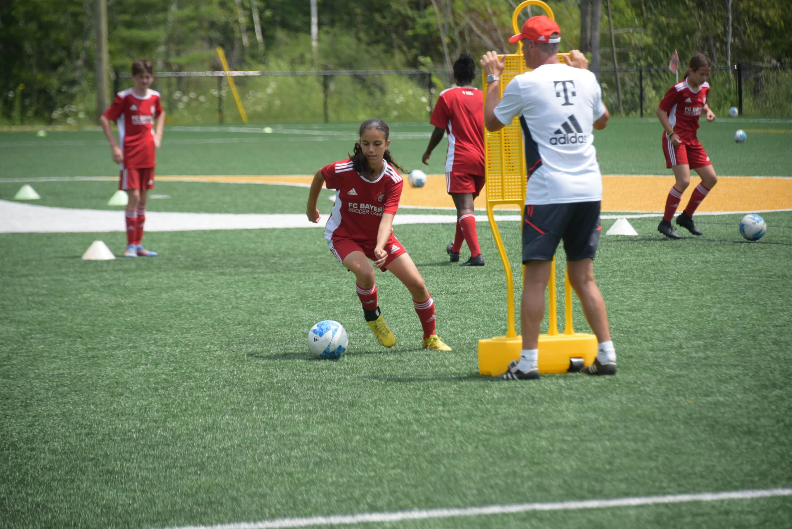 A girl performing soccer warm-up exercises